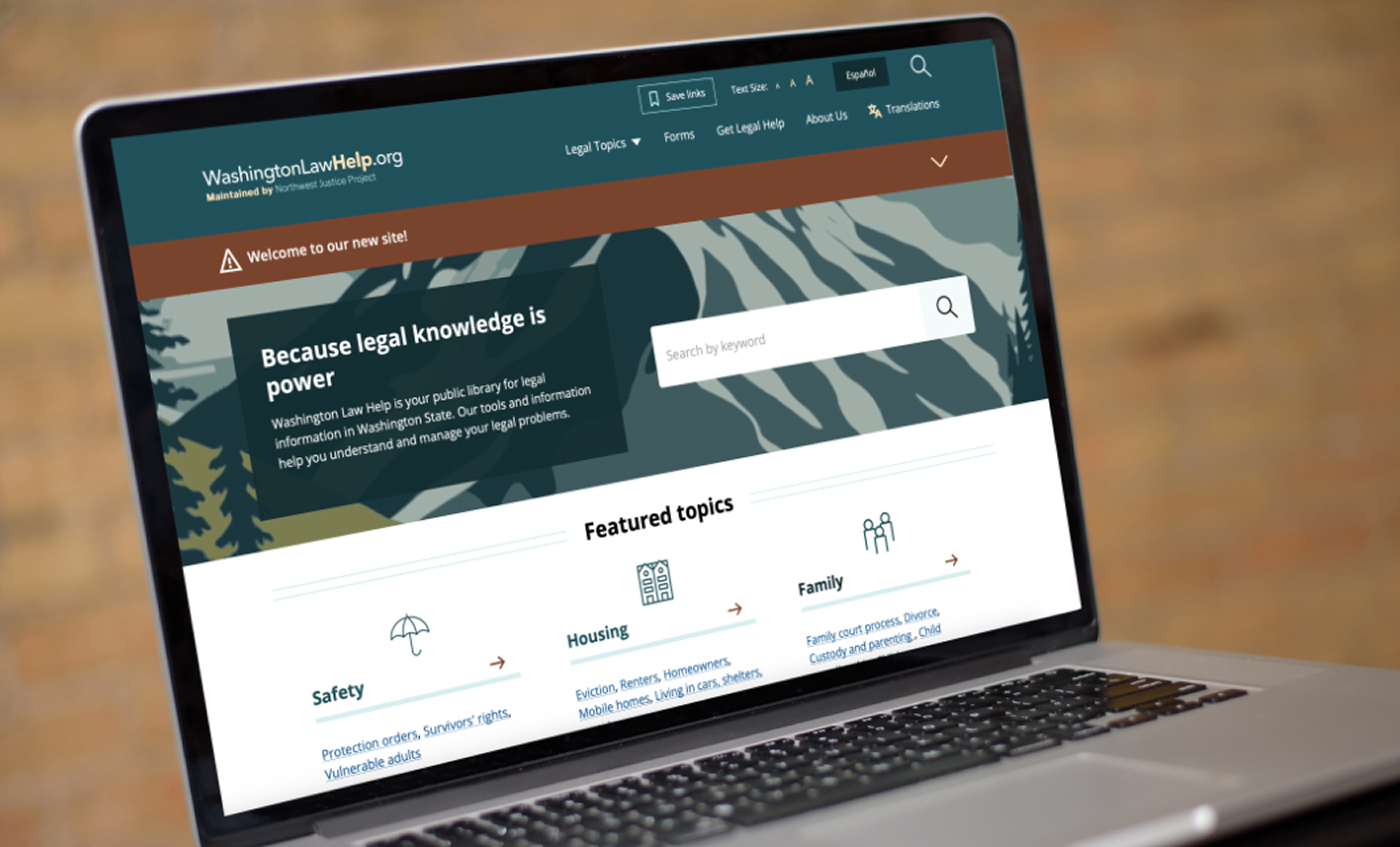 The Washington Law Help homepage on a laptop computer